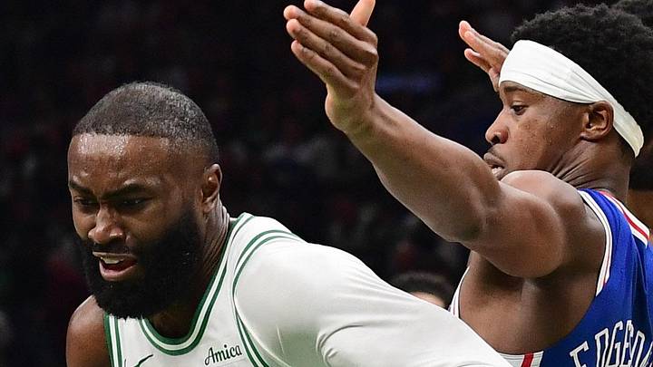 Apr 19, 2026; Boston, Massachusetts, USA; Philadelphia 76ers guard Vj Edgecombe (77) defends Boston Celtics guard Jaylen Brown (7) in the second half during game one of the first round of the 2026 NBA Playoffs at TD Garden. Mandatory Credit: Bob DeChiara-Imagn Images