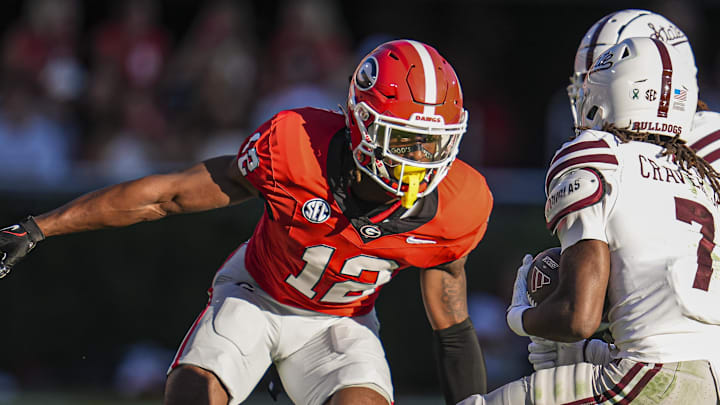 Oct 12, 2024; Athens, Georgia, USA; Georgia Bulldogs defensive back Julian Humphrey (12) tries got tackle Mississippi State Bulldogs wide receiver Mario Craver (7) at Sanford Stadium. Mandatory Credit: Dale Zanine-Imagn Images