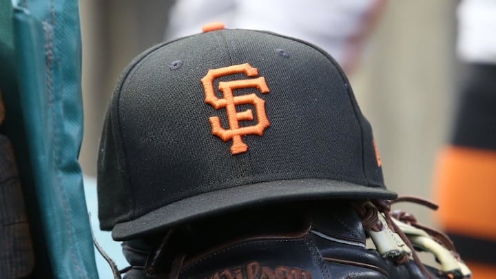 Jul 14, 2023; Pittsburgh, Pennsylvania, USA;  San Francisco Giants hat and glove on the bench against the Pittsburgh Pirates during the first inning at PNC Park. 