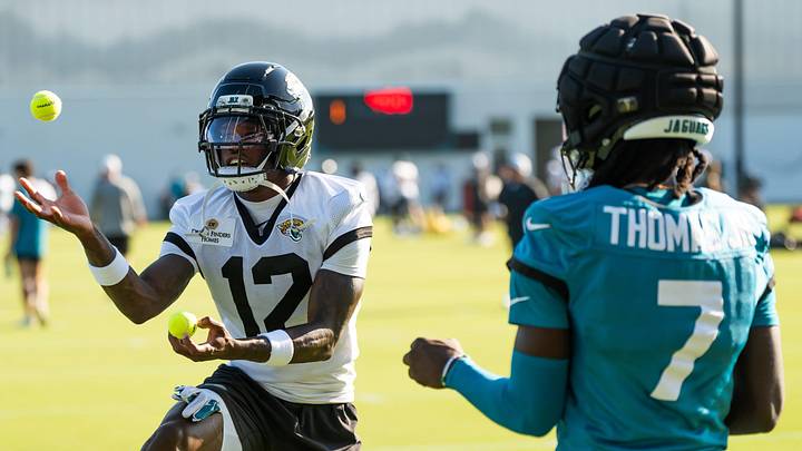 Jacksonville Jaguars wide receiver Travis Hunter (12) and Jacksonville Jaguars wide receiver Brian Thomas Jr. (7) use tennis balls in a drill during an NFL training camp fourth session at the Miller Electric Center, Sunday, July 27, 2025, in Jacksonville, Fla. [Doug Engle/Florida Times-Union]