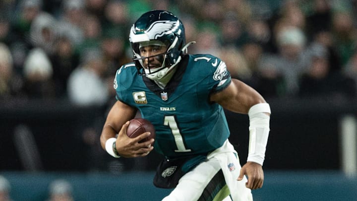 Nov 14, 2024; Philadelphia, Pennsylvania, USA; against the Washington CommandersPhiladelphia Eagles quarterback Jalen Hurts (1) runs with he ball during the fourth quarter at Lincoln Financial Field. Mandatory Credit: Bill Streicher-Imagn Images