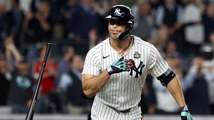New York Yankees designated hitter Giancarlo Stanton reacts to hitting a home run.