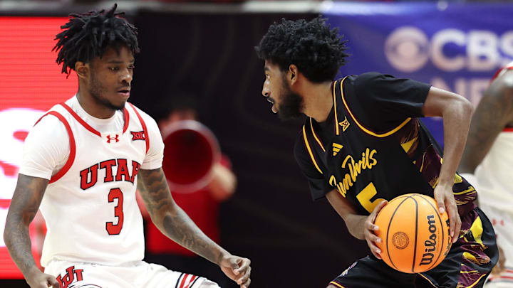 Feb 4, 2026; Salt Lake City, Utah, USA; Arizona State Sun Devils guard Maurice Odum (5) controls the ball against Utah Utes guard Don McHenry (3) during the second half at Jon M. Huntsman Center. Mandatory Credit: Rob Gray-Imagn Images