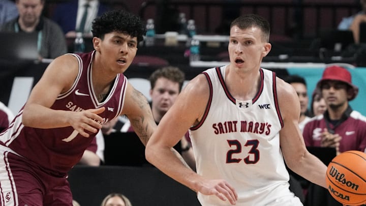 March 9, 2026; Las Vegas, NV, USA; Saint Mary's Gaels forward Paulius Murauskas (23) dribbles the basketball against Santa Clara Broncos guard Christian Hammond (1) during the first half at Orleans Arena. Mandatory Credit: Kyle Terada-Imagn Images