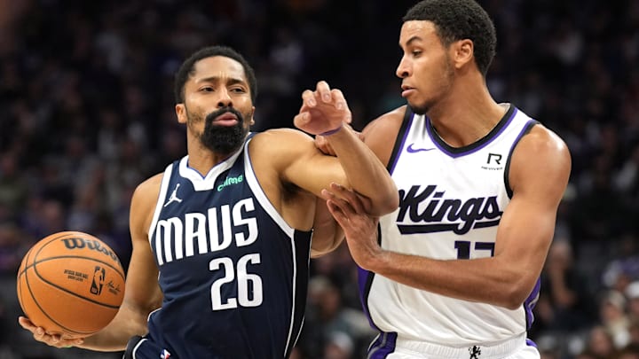 Dec 30, 2024; Sacramento, California, USA; Dallas Mavericks guard Spencer Dinwiddie (26) drives against Sacramento Kings forward Keegan Murray (right) during the second quarter at Golden 1 Center. Mandatory Credit: Darren Yamashita-Imagn Images