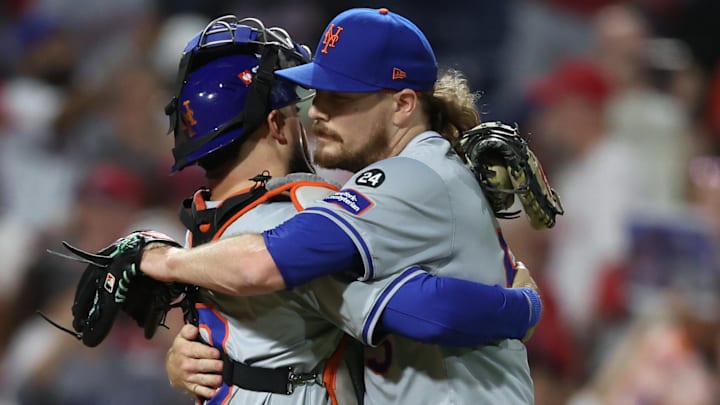 New York Mets pitcher Ryne Stanek (55) and Mets catcher Luis Torrens (13) celebrate after defeating the Philadelphia Phillies in game one of the NLDS for the 2024 MLB Playoffs at Citizens Bank Park. 