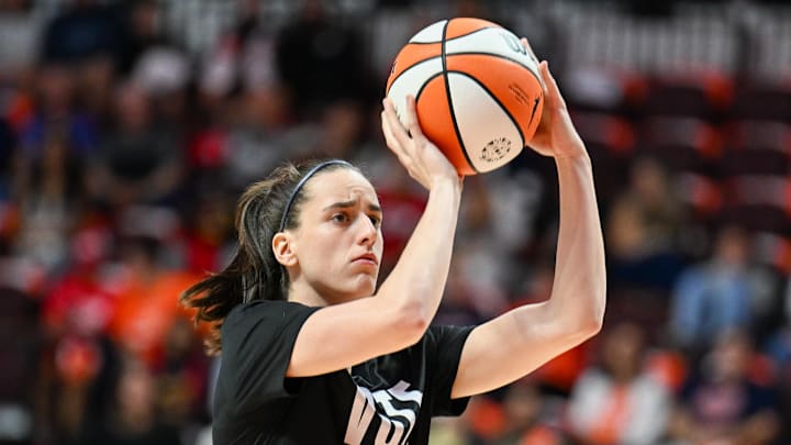 Indiana Fever guard Caitlin Clark warms up before a game.