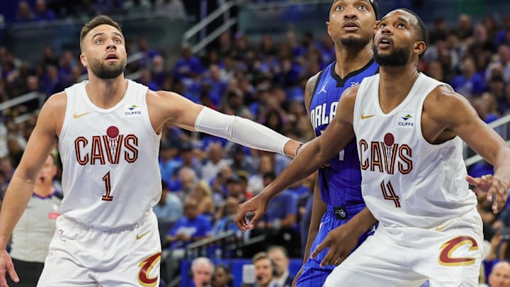 May 3, 2024; Orlando, Florida, USA; Cleveland Cavaliers guard Max Strus (1) forward Evan Mobley (4) and Orlando Magic center Wendell Carter Jr. (34) look for the rebound during the second quarter of game six of the first round for the 2024 NBA playoffs at Kia Center. Mandatory Credit: Mike Watters-Imagn Images