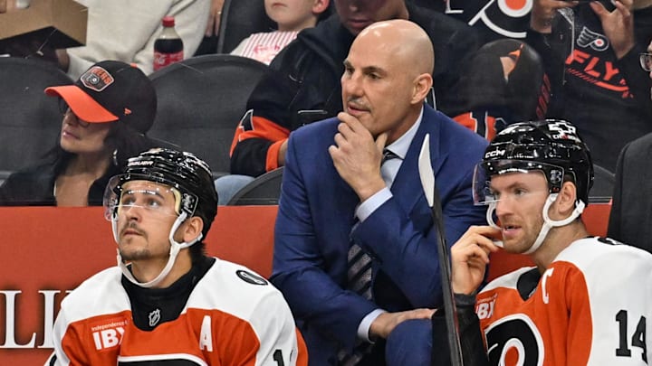 Oct 13, 2025; Philadelphia, Pennsylvania, USA; Philadelphia Flyers head coach Rick Tocchet with right wing Travis Konecny (11) and center Sean Couturier (14) against the Florida Panthers during the first period at Wells Fargo Center. Mandatory Credit: Eric Hartline-Imagn Images Oct 13, 2025; Philadelphia, Pennsylvania, USA; Philadelphia Flyers head coach Rick Tocchet with right wing Travis Konecny (11) and center Sean Couturier (14) against the Florida Panthers during the first period at Wells Fargo Center. Mandatory Credit: Eric Hartline-Imagn Images