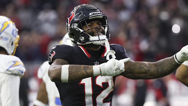 Jan 11, 2025; Houston, Texas, USA;  Houston Texans wide receiver Nico Collins (12) reacts to a first down against the Los Angeles Chargers in the second quarter in an AFC wild card game at NRG Stadium. Mandatory Credit: Thomas Shea-Imagn Images