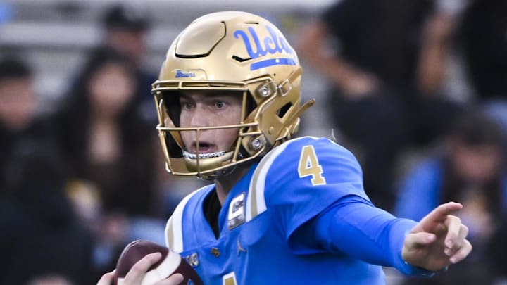 Nov 30, 2024; Pasadena, California, USA; UCLA Bruins quarterback Ethan Garbers (4) scrambles out of the pocket against the Fresno State Bulldogs during the fourth quarter at Rose Bowl. Mandatory Credit: Robert Hanashiro-Imagn Images
