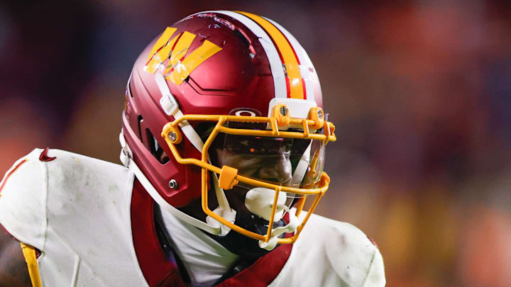 Washington Commanders wide receiver Deebo Samuel after a reception defended by Denver Broncos cornerback Riley Moss. Washington Commanders wide receiver Deebo Samuel after a reception defended by Denver Broncos cornerback Riley Moss.