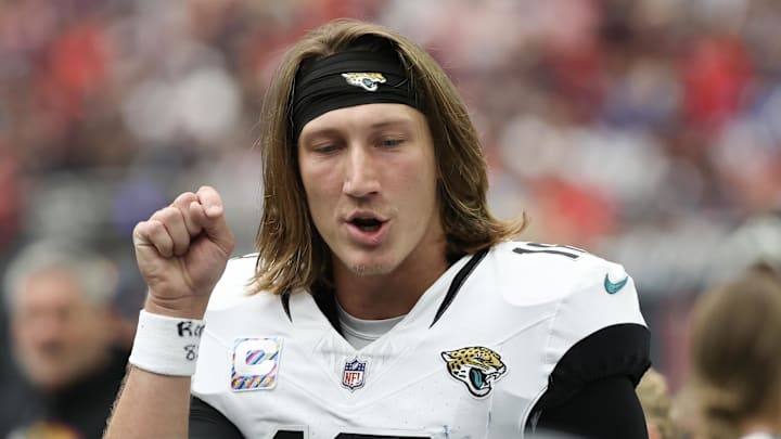 Sep 29, 2024; Houston, Texas, USA; Jacksonville Jaguars quarterback Trevor Lawrence (16) talks to his team on the bench after they scored against the Houston Texans at NRG Stadium. Mandatory Credit: Thomas Shea-Imagn Images