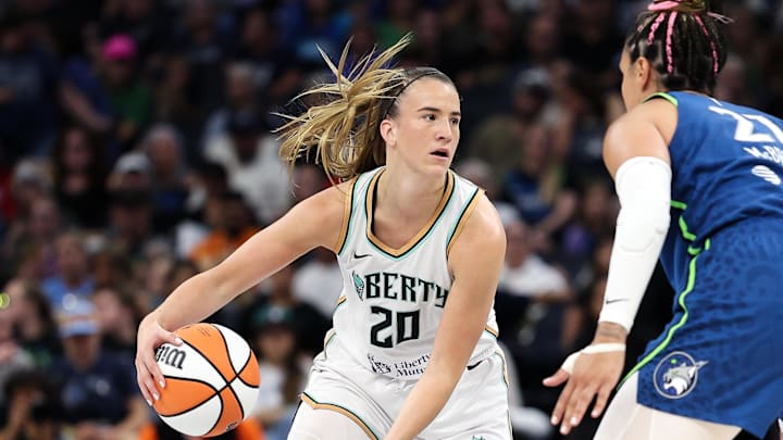 Aug 16, 2025; Minneapolis, Minnesota, USA; New York Liberty guard Sabrina Ionescu (20) works around Minnesota Lynx guard Kayla McBride (21) during the first quarter at Target Center. Mandatory Credit: Matt Krohn-Imagn Images