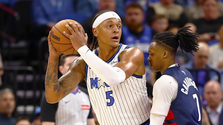 Mar 3, 2026; Orlando, Florida, USA; Washington Wizards guard Bub Carrington (7) attempts to defend Orlando Magic forward Paolo Banchero (5)in the first half at Kia Center. Mandatory Credit: Russell Lansford-Imagn Images Mar 3, 2026; Orlando, Florida, USA; Washington Wizards guard Bub Carrington (7) attempts to defend Orlando Magic forward Paolo Banchero (5)in the first half at Kia Center. Mandatory Credit: Russell Lansford-Imagn Images
