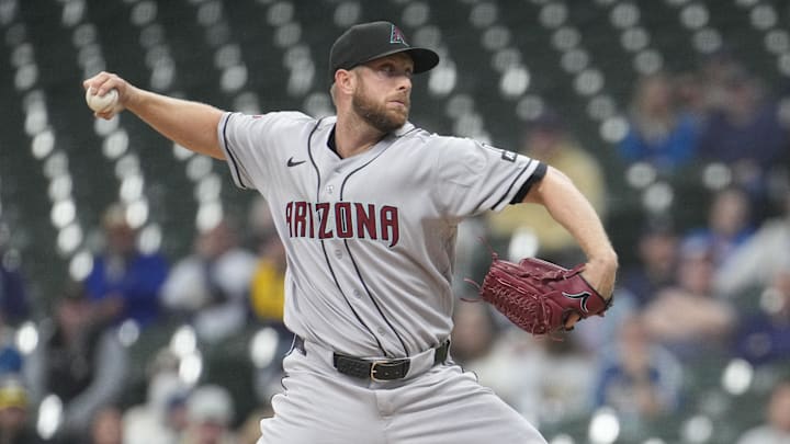 Apr 28, 2026; Milwaukee, Wisconsin, USA; Arizona Diamondbacks pitcher Merrill Kelly (29) delivers  a pitch against the Milwaukee Brewers in the first inning at American Family Field. Mandatory Credit: Michael McLoone-Imagn Images