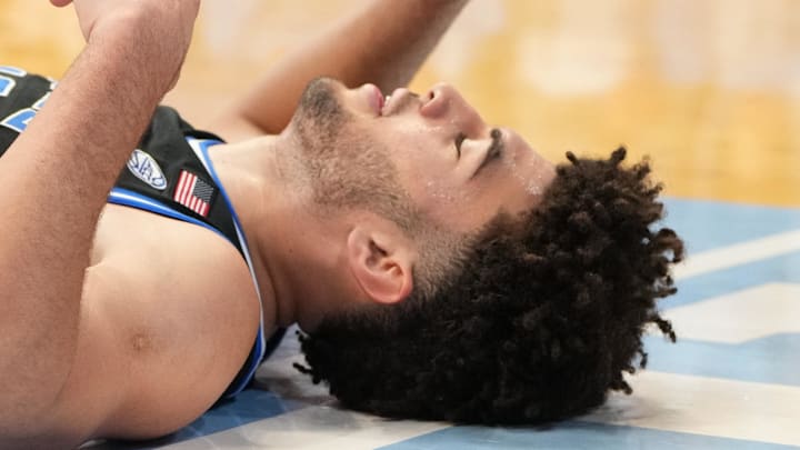 Feb 7, 2026; Chapel Hill, North Carolina, USA; Duke Blue Devils forward Cameron Boozer (12) on the floor in the second  half at Dean E. Smith Center. Mandatory Credit: Bob Donnan-Imagn Images