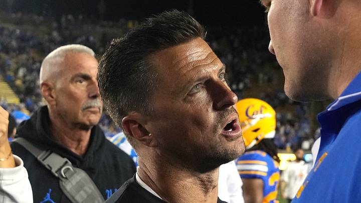 Sep 5, 2026; Berkeley, California, USA; UCLA Bruins head coach Bob Chesney (center left) and California Golden Bears head coach Tosh Lupoi (right) talk after the game at California Memorial Stadium. Mandatory Credit: Darren Yamashita-Imagn Images Sep 5, 2026; Berkeley, California, USA; UCLA Bruins head coach Bob Chesney (center left) and California Golden Bears head coach Tosh Lupoi (right) talk after the game at California Memorial Stadium. Mandatory Credit: Darren Yamashita-Imagn Images