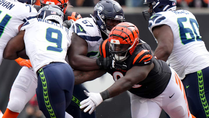 Cincinnati Bengals defensive tackle DJ Reader (98) looks to tackle Seattle Seahawks running back Kenneth Walker III (9) in the second quarter during an NFL football game between the Seattle Seahawks and the Cincinnati Bengals Sunday, Oct. 15, 2023, at Paycor Stadium in Cincinnati.