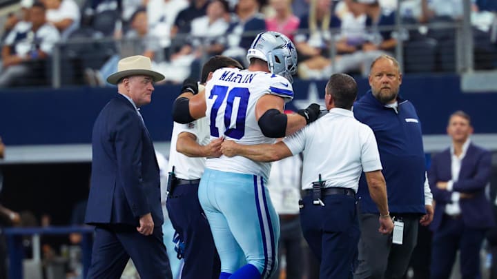 Sep 15, 2024; Arlington, Texas, USA; Dallas Cowboys guard Zack Martin (70) walsk off injured during the second half against the New Orleans Saints at AT&T Stadium. Mandatory Credit: Kevin Jairaj-Imagn Images