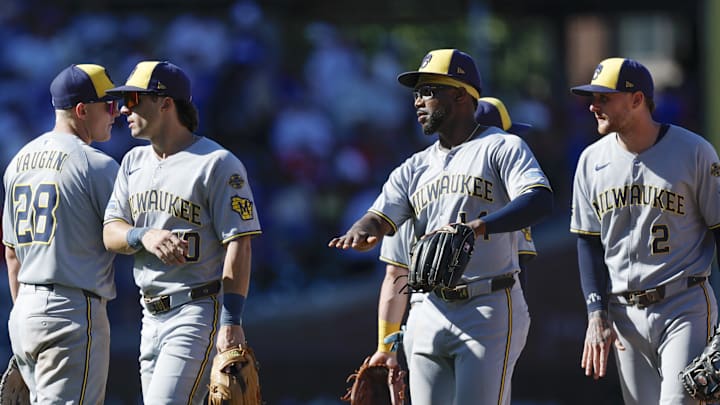 Aug 21, 2025; Chicago, Illinois, USA; Milwaukee Brewers players celebrate team's win against the Chicago Cubs in a baseball game at Wrigley Field. Mandatory Credit: Kamil Krzaczynski-Imagn Images
