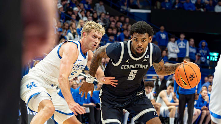 Georgetown’s KJ Lewis (5) drove to the basket for a score as the Kentucky Wildcats host the Georgetown Hoyas at Rupp Arena in Lexington on Thursday, Oct. 30, 2025.