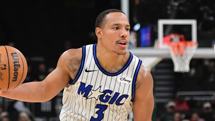 Mar 8, 2026; Milwaukee, Wisconsin, USA; Orlando Magic guard Desmond Bane (3) drives for the basket against Milwaukee Bucks guard Ryan Rollins (13) in the fourth quarter at Fiserv Forum. Mandatory Credit: Benny Sieu-Imagn Images