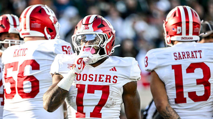 Indiana running back Ty Son Lawton silences the crowd after a touchdown run against Michigan State at Spartan Stadium in East Lansing.