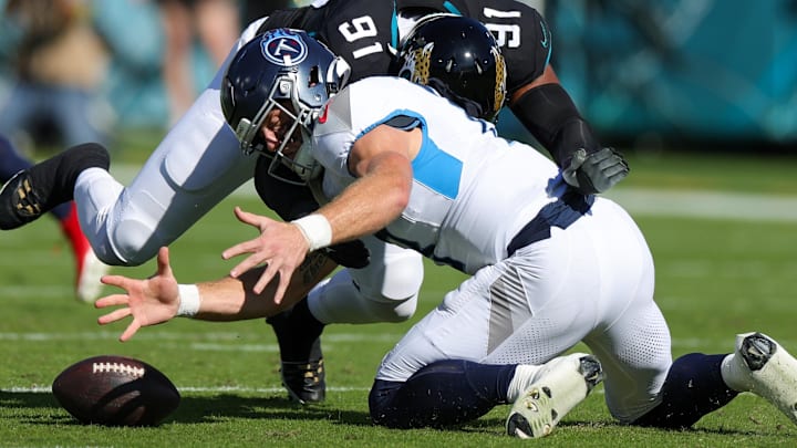 Nov 19, 2023; Jacksonville, Florida, USA; Tennessee Titans quarterback Will Levis (8) fumbles the ball pressured by Jacksonville Jaguars linebacker Dawuane Smoot (91) in the first quarter at EverBank Stadium. Mandatory Credit: Nathan Ray Seebeck-Imagn Images Nov 19, 2023; Jacksonville, Florida, USA; Tennessee Titans quarterback Will Levis (8) fumbles the ball pressured by Jacksonville Jaguars linebacker Dawuane Smoot (91) in the first quarter at EverBank Stadium. Mandatory Credit: Nathan Ray Seebeck-Imagn Images