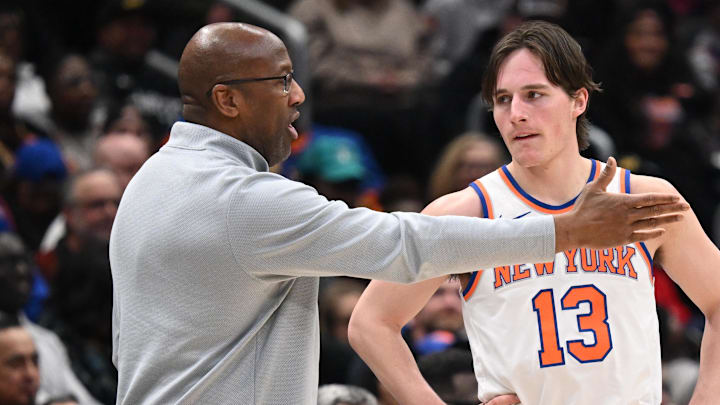 Feb 3, 2026; Washington, District of Columbia, USA; New York Knicks guard Tyler Kolek (13) listens to head coach Mike Brown during a break in the action against the Washington Wizards during the fourth quarter at Capital One Arena.