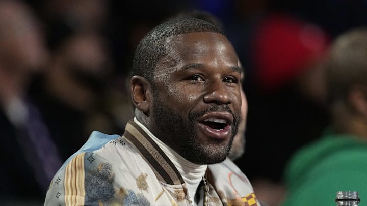 Dec 14, 2024; Las Vegas, Nevada, USA; Floyd Mayweather looks on during the first half between the Milwaukee Bucks and the Atlanta Hawks in a semifinal of the 2024 Emirates NBA Cup at T-Mobile Arena. Mandatory Credit: Kyle Terada-Imagn Images Dec 14, 2024; Las Vegas, Nevada, USA; Floyd Mayweather looks on during the first half between the Milwaukee Bucks and the Atlanta Hawks in a semifinal of the 2024 Emirates NBA Cup at T-Mobile Arena. Mandatory Credit: Kyle Terada-Imagn Images