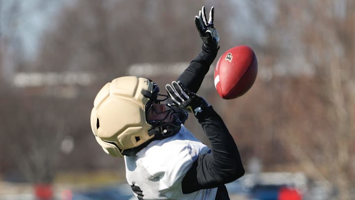 Purdue Boilermakers defensive back Crew Wakley (7) goes for a catch Purdue Boilermakers defensive back Crew Wakley (7) goes for a catch