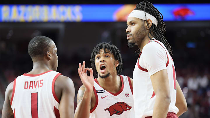 Arkansas Razorbacks guard D.J. Wagner (middle) talks to guard Johnell Davis and center Jonas Aidoo during the first half against the Mississippi State Bulldogs at Bud Walton Arena on Saturday.