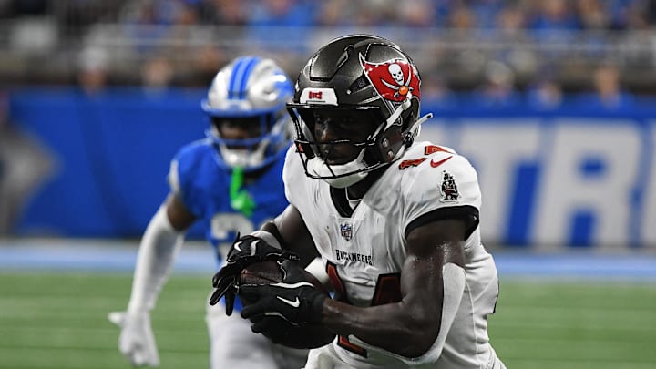 Sep 15, 2024; Detroit, Michigan, USA; Tampa Bay Buccaneers wide receiver Chris Godwin (14) scores a touchdown against the Detroit Lions in the second quarter at Ford Field. Mandatory Credit: Eamon Horwedel-Imagn Images