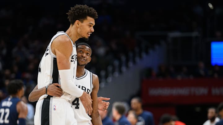Feb 10, 2025; Washington, District of Columbia, USA; San Antonio Spurs center Victor Wembanyama (1) and guard De'Aaron Fox (4) react during the second quarter against the Washington Wizards at Capital One Arena. 