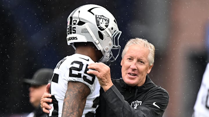 Sep 7, 2025; Foxborough, Massachusetts, USA; Las Vegas Raiders head coach Pete Carroll reacts with cornerback Decamerion Richardson (25) before the game at Gillette Stadium. Mandatory Credit: Brian Fluharty-Imagn Images