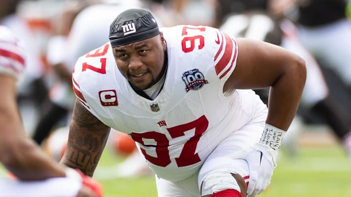 Sep 22, 2024; Cleveland, Ohio, USA; New York Giants defensive tackle Dexter Lawrence II (97) stretches during warm ups before the game against the Cleveland Browns at Huntington Bank Field. Mandatory Credit: Scott Galvin-Imagn Images