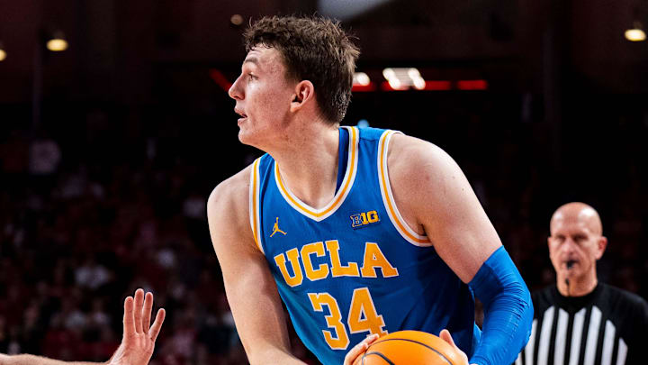 Jan 4, 2025; Lincoln, Nebraska, USA; UCLA Bruins forward Tyler Bilodeau (34) looks to pass against Nebraska Cornhuskers forward Andrew Morgan (23) during the second half at Pinnacle Bank Arena. Mandatory Credit: Dylan Widger-Imagn Images Jan 4, 2025; Lincoln, Nebraska, USA; UCLA Bruins forward Tyler Bilodeau (34) looks to pass against Nebraska Cornhuskers forward Andrew Morgan (23) during the second half at Pinnacle Bank Arena. Mandatory Credit: Dylan Widger-Imagn Images