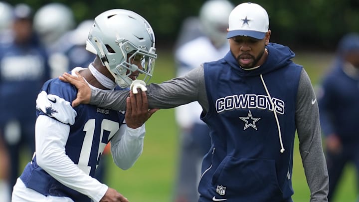 Dallas Cowboys DB Caleb Downs is coached through a drill with defensive coordinator Christian Parker.