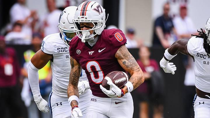 Sep 12, 2026; Blacksburg, Va.; Virginia Tech wide receiver Ayden Greene (0) runs with the ball as Old Dominion players pursue.