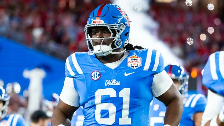 Jan 8, 2026; Glendale, AZ, USA; Mississippi Rebels offensive lineman Diego Pounds (61) against the Miami Hurricanes during the 2026 Fiesta Bowl and semifinal game of the College Football Playoff at State Farm Stadium. Mandatory Credit: Mark J. Rebilas-Imagn Images Jan 8, 2026; Glendale, AZ, USA; Mississippi Rebels offensive lineman Diego Pounds (61) against the Miami Hurricanes during the 2026 Fiesta Bowl and semifinal game of the College Football Playoff at State Farm Stadium. Mandatory Credit: Mark J. Rebilas-Imagn Images