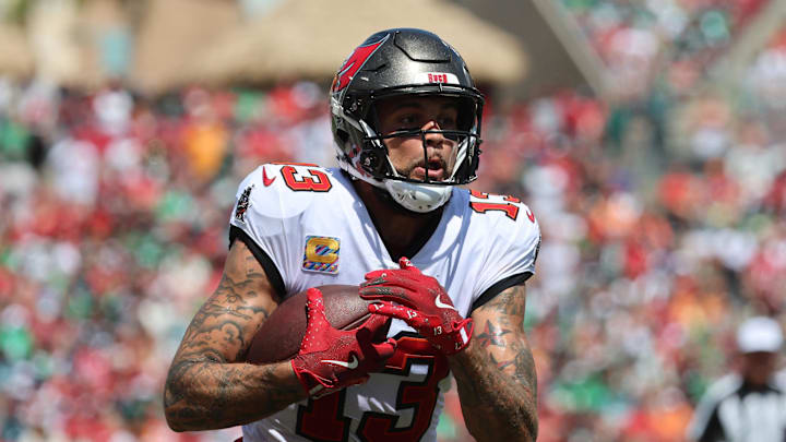 Sep 29, 2024; Tampa, Florida, USA; Tampa Bay Buccaneers wide receiver Mike Evans (13) runs with the ball against the Philadelphia Eagles during the first half at Raymond James Stadium. Mandatory Credit: Kim Klement Neitzel-Imagn Images