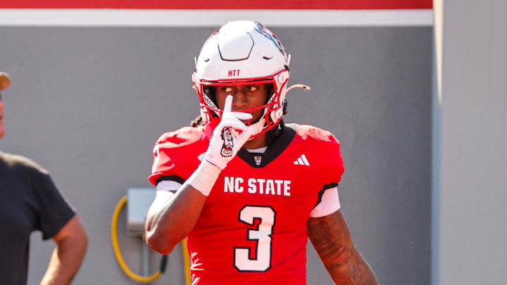 Oct 4, 2025; Raleigh, North Carolina, USA;  NC State Wolfpack running back Hollywood Smothers (3) celebrates a touchdown during the first half of the game against Campbell Fighting Camels at Carter-Finley Stadium. Mandatory Credit: Jaylynn Nash-Imagn Images