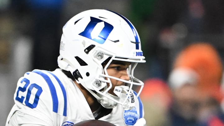 Dec 6, 2025; Charlotte, NC, USA; Duke Blue Devils running back Nate Sheppard (20) receives a hand off in the second quarter against the Virginia Cavaliers during the 2025 ACC Championship game at Bank of America Stadium. Mandatory Credit: Bob Donnan-Imagn Images Dec 6, 2025; Charlotte, NC, USA; Duke Blue Devils running back Nate Sheppard (20) receives a hand off in the second quarter against the Virginia Cavaliers during the 2025 ACC Championship game at Bank of America Stadium. Mandatory Credit: Bob Donnan-Imagn Images