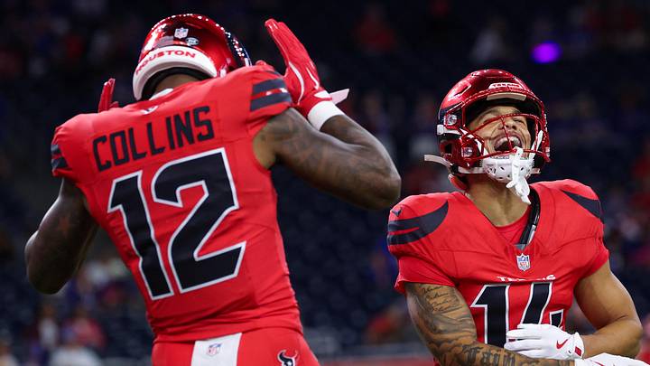 Nov 20, 2025; Houston, Texas, USA;  Houston Texans wide receiver Nico Collins (12) jokes around with wide receiver Quintez Cephus (14) before playing against the Buffalo Bills before playing against the Buffalo Bills at NRG Stadium. Mandatory Credit: Thomas Shea-Imagn Images