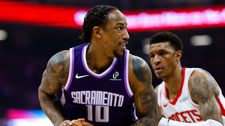 Dec 21, 2025; Sacramento, California, USA; Sacramento Kings guard DeMar DeRozan (10) controls the ball against Houston Rockets forward Jabari Smith Jr. (10) during the first quarter at Golden 1 Center.
