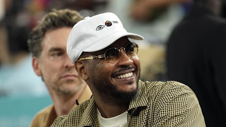 Aug 6, 2024; Paris, France; Carmelo Anthony looks on in the first half between France and Canada in a men’s basketball quarterfinal game during the Paris 2024 Olympic Summer Games at Accor Arena. Mandatory Credit: Kyle Terada-Imagn Images Aug 6, 2024; Paris, France; Carmelo Anthony looks on in the first half between France and Canada in a men’s basketball quarterfinal game during the Paris 2024 Olympic Summer Games at Accor Arena. Mandatory Credit: Kyle Terada-Imagn Images