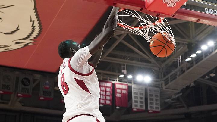 Arkansas forward Maper Maker dunks against Memphis. Arkansas forward Maper Maker dunks against Memphis.