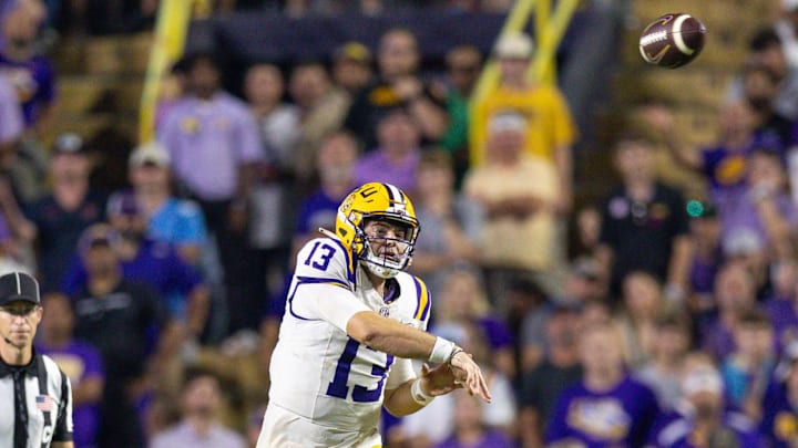 LSU Tigers quarterback Garrett Nussmeier (13) throws for a first down against the Mississippi Rebels during the second half at Tiger Stadium. LSU Tigers quarterback Garrett Nussmeier (13) throws for a first down against the Mississippi Rebels during the second half at Tiger Stadium.