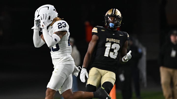 Nov 16, 2024; West Lafayette, Indiana, USA; Penn State Nittany Lions cornerback Antoine Belgrave-Shorter (23) reacts to missing an interception in front of Purdue Boilermakers wide receiver Jaron Tibbs (13) during the second half at Ross-Ade Stadium. Mandatory Credit: Marc Lebryk-Imagn Images